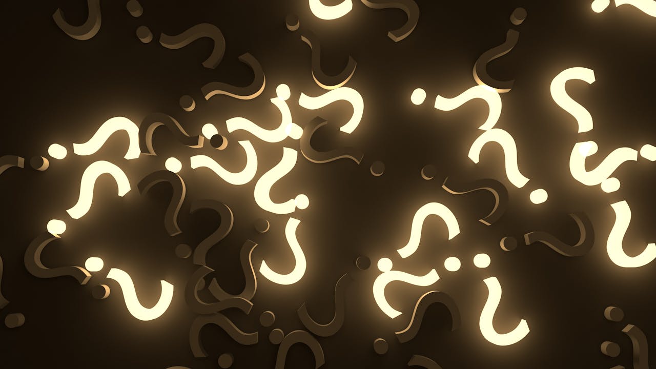 services-01 Abstract image of glowing question marks against a dark background, creating a mysterious atmosphere.